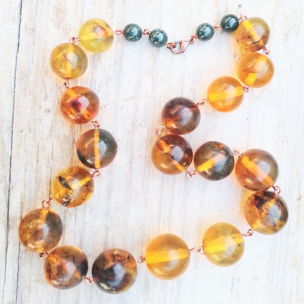 Large amber ball spheres copper chain necklace with jade beads. Boho look.